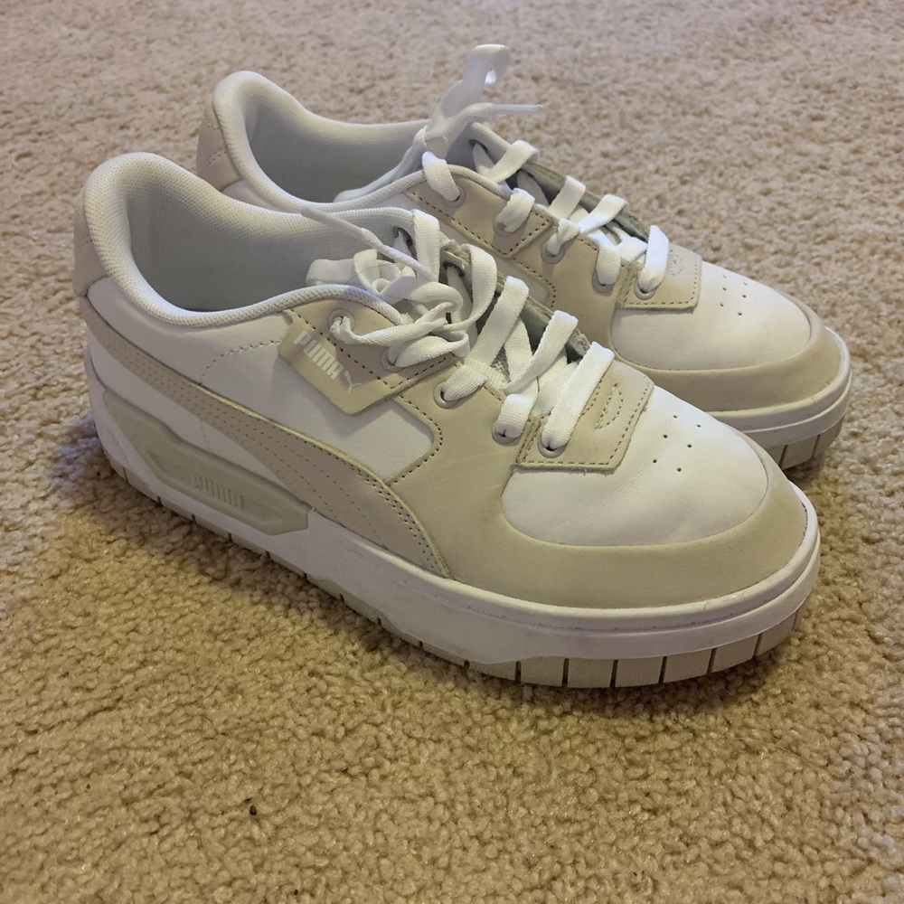 Beige and white pumas